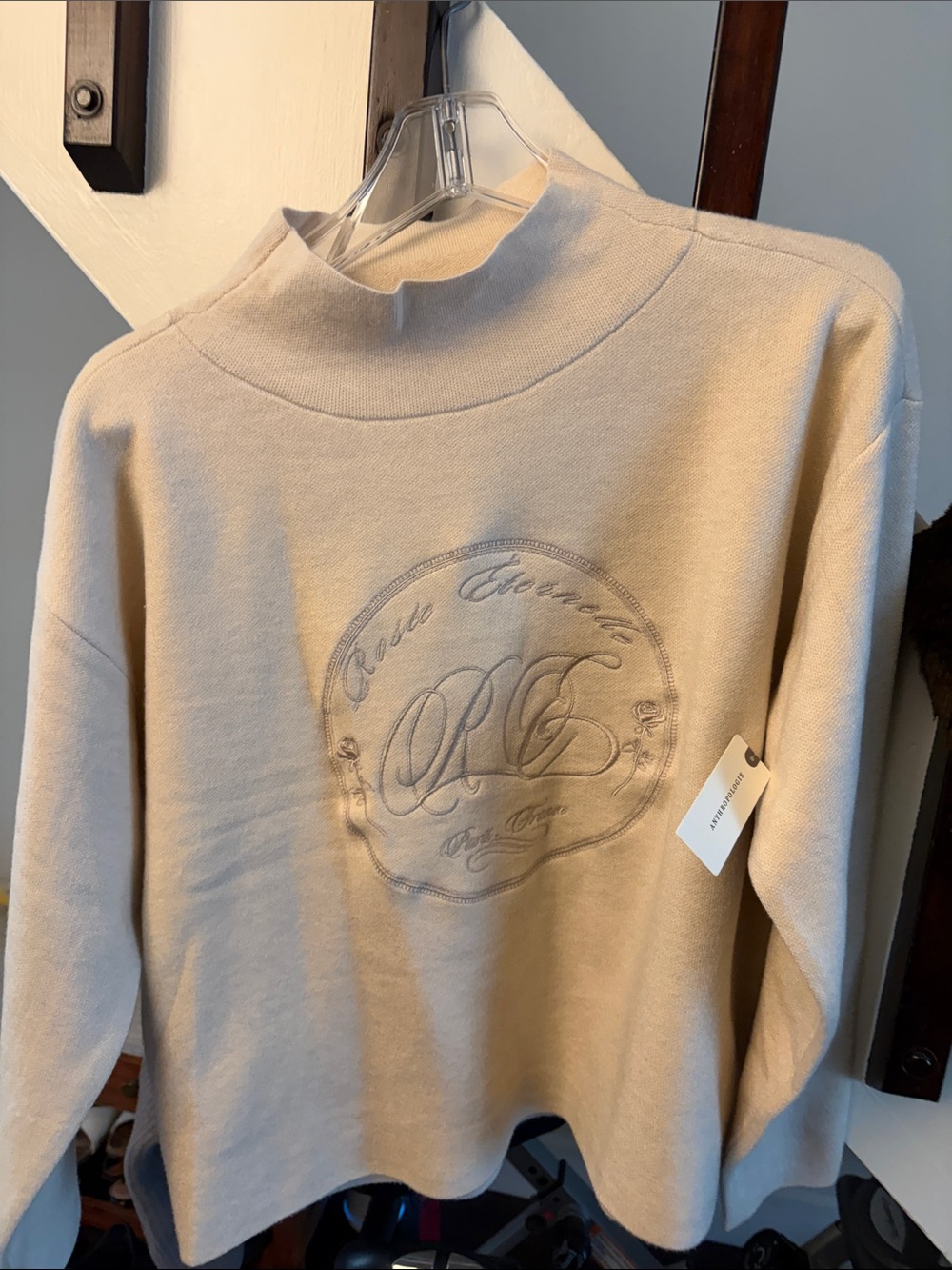 Anthropologie Cream Embroidered Logo Knit Top